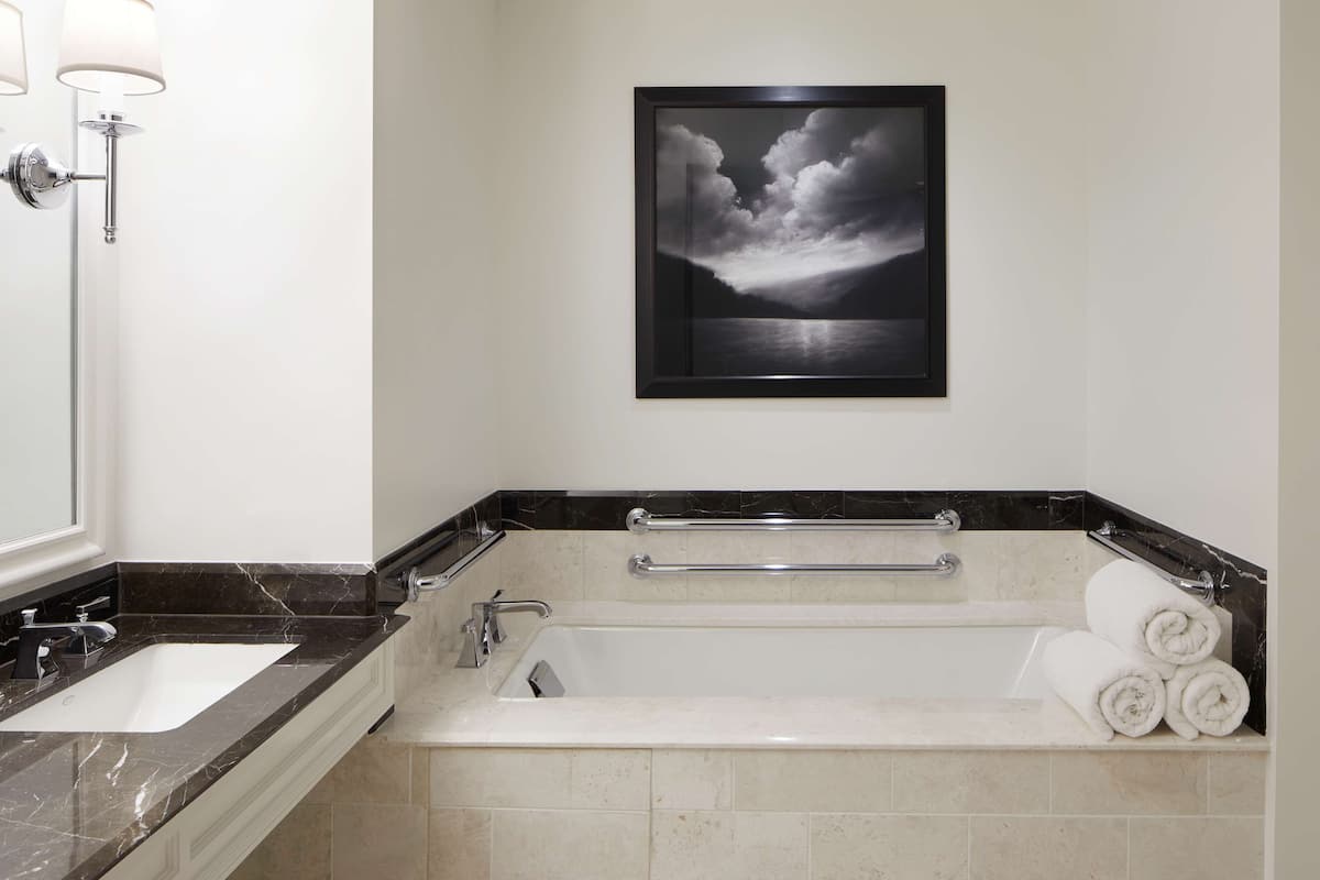 Separate tub and shower, deep soaking tub, designer toiletries
