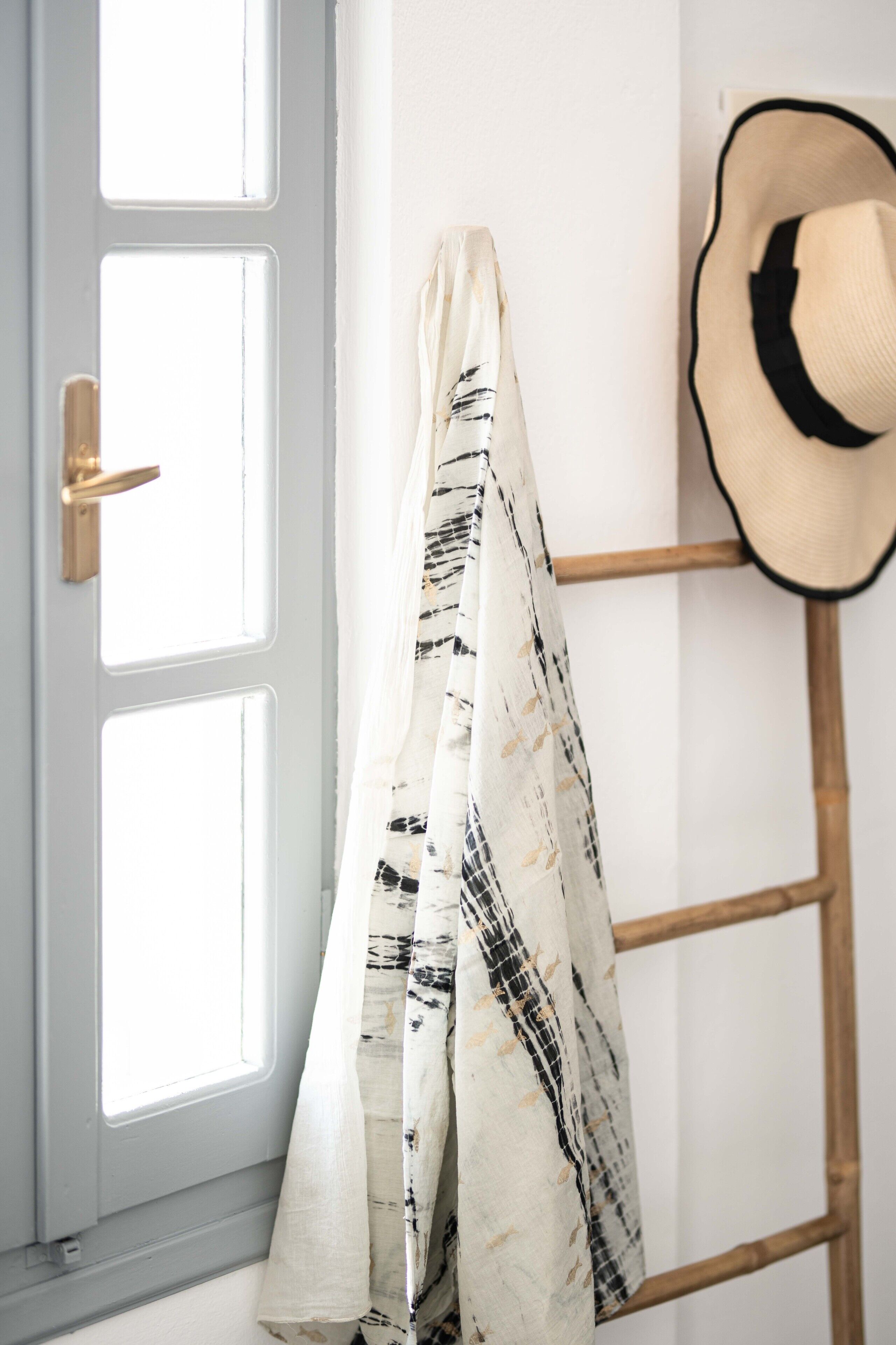 A door with a white frame and a brass handle.