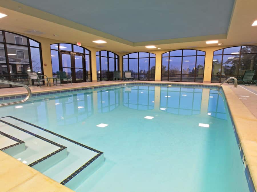 Indoor pool, open 8:00 AM to 10:00 PM, pool loungers