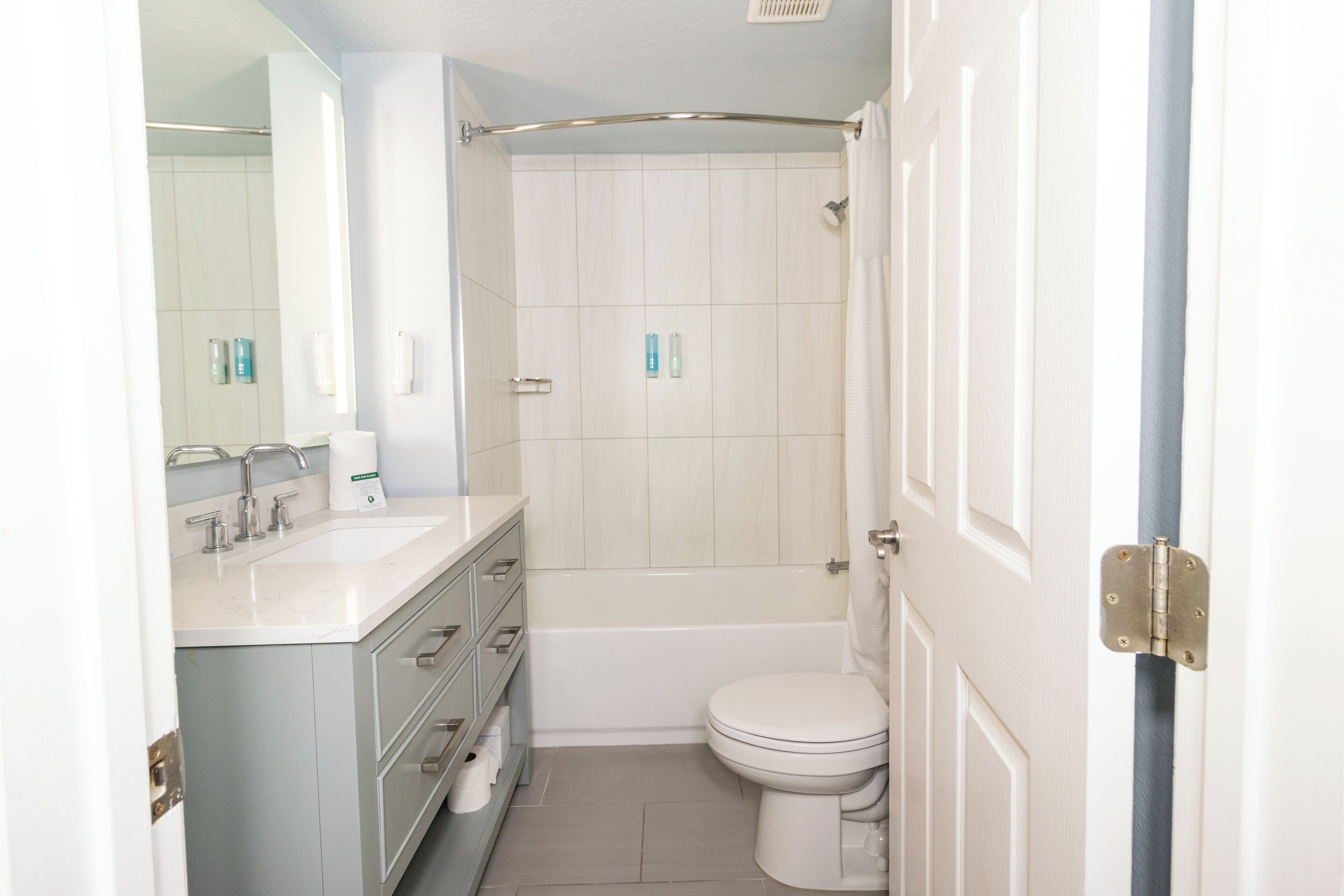 eco-friendly toiletries, hair dryer, towels, soap