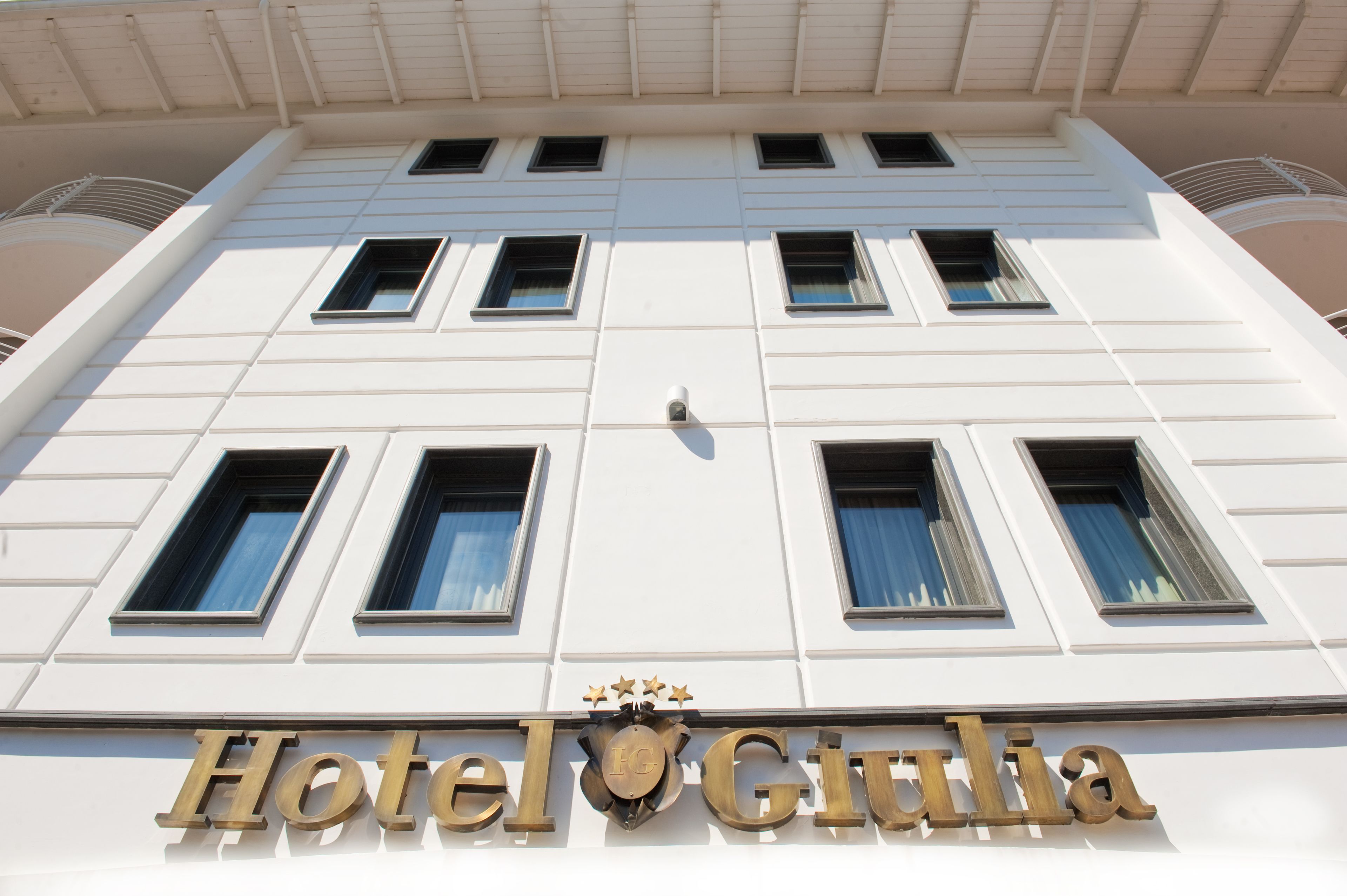 A building with a sign reading "Hotel Giulia."