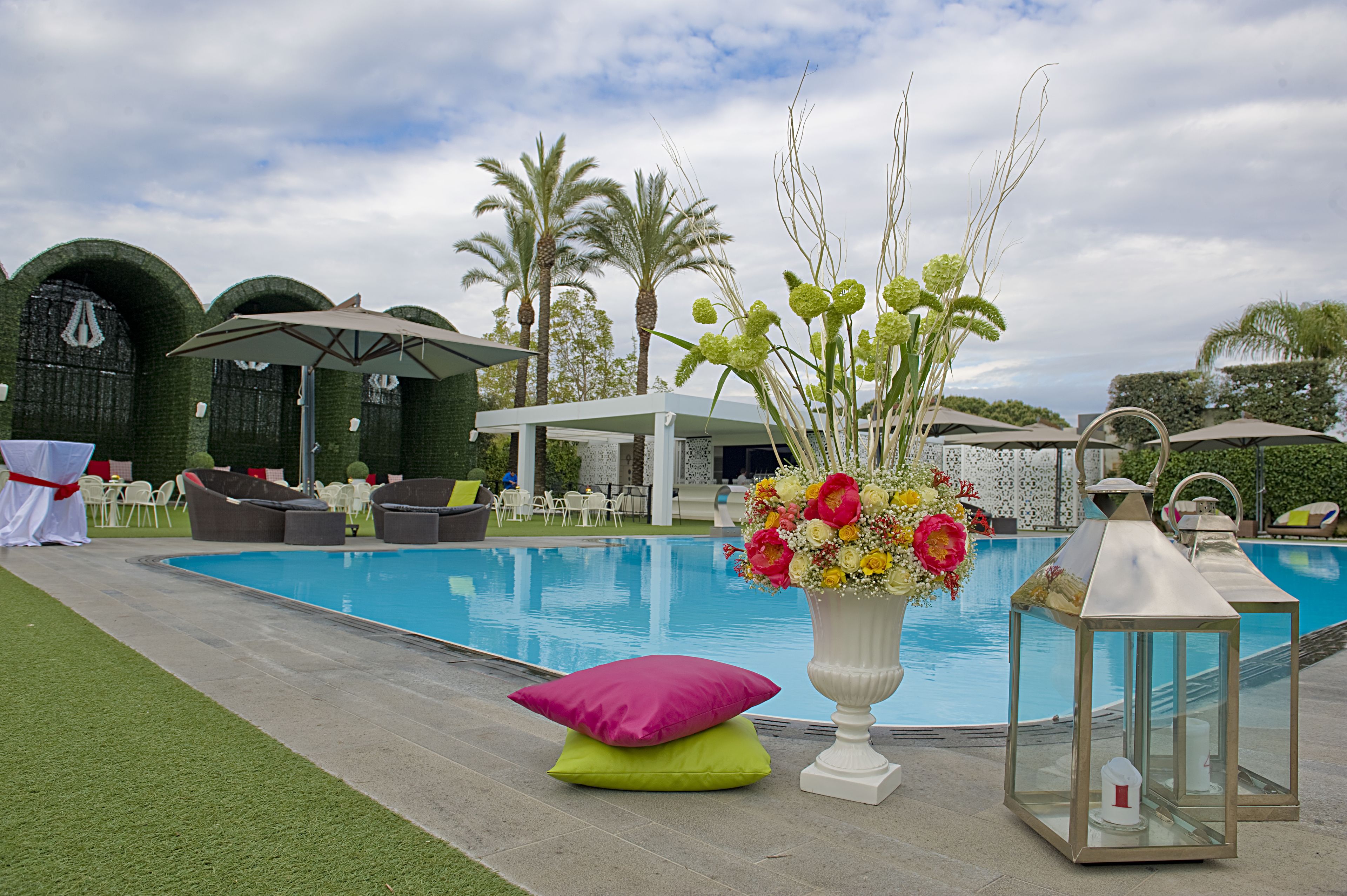 Seasonal outdoor pool, open 9:30 AM to 6:00 PM, pool umbrellas