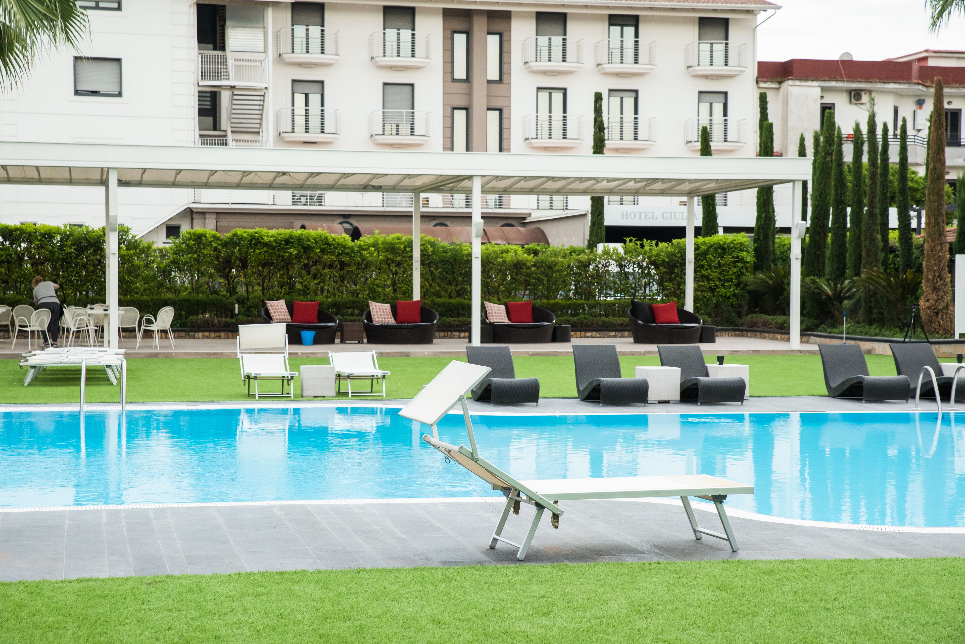 Seasonal outdoor pool, open 9:30 AM to 6:00 PM, pool umbrellas