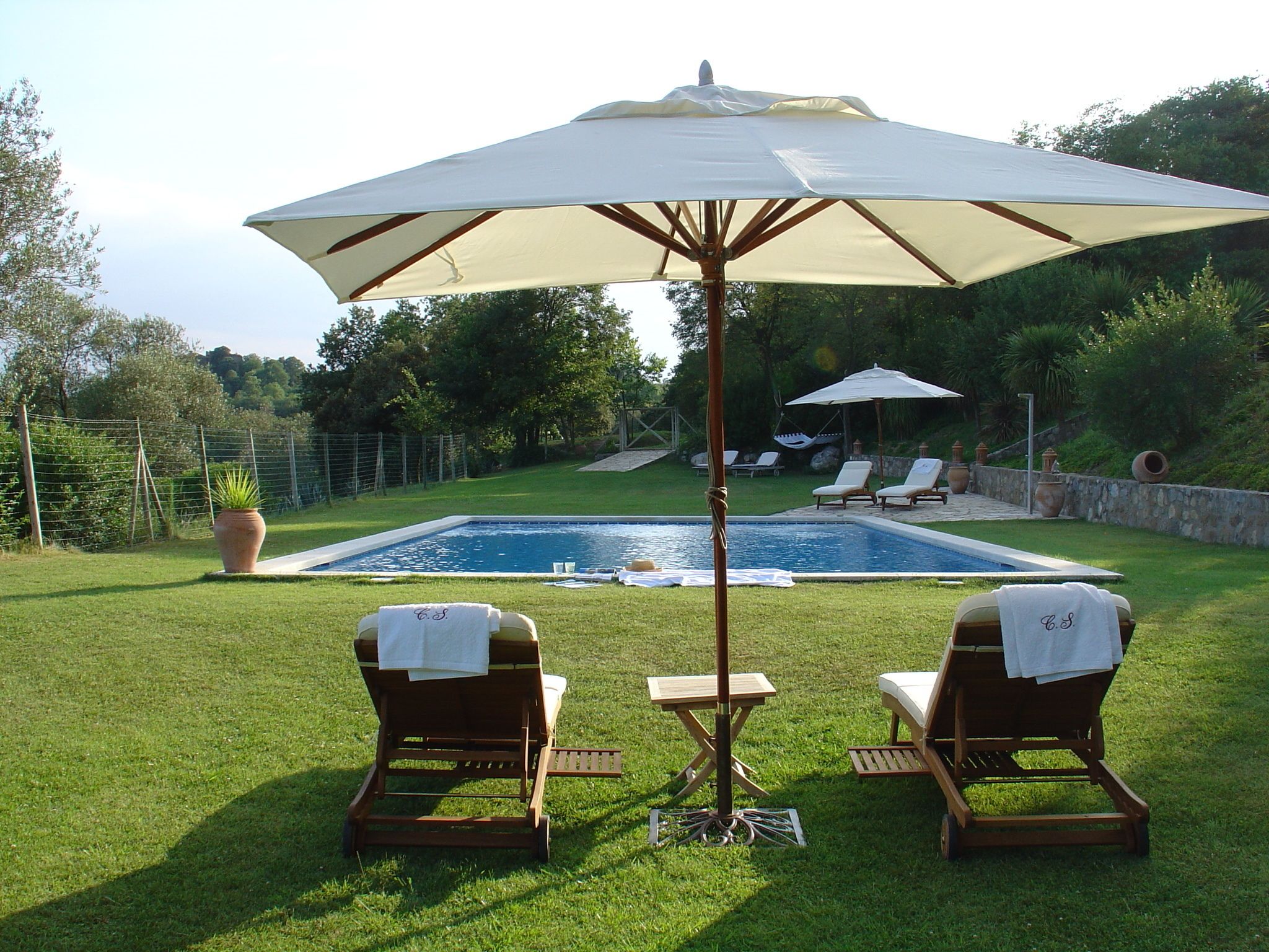outdoor pool, pool umbrellas, pool loungers