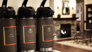 Three insulated water bottles labeled 'Highridge Country Reserve' on a kitchen counter.