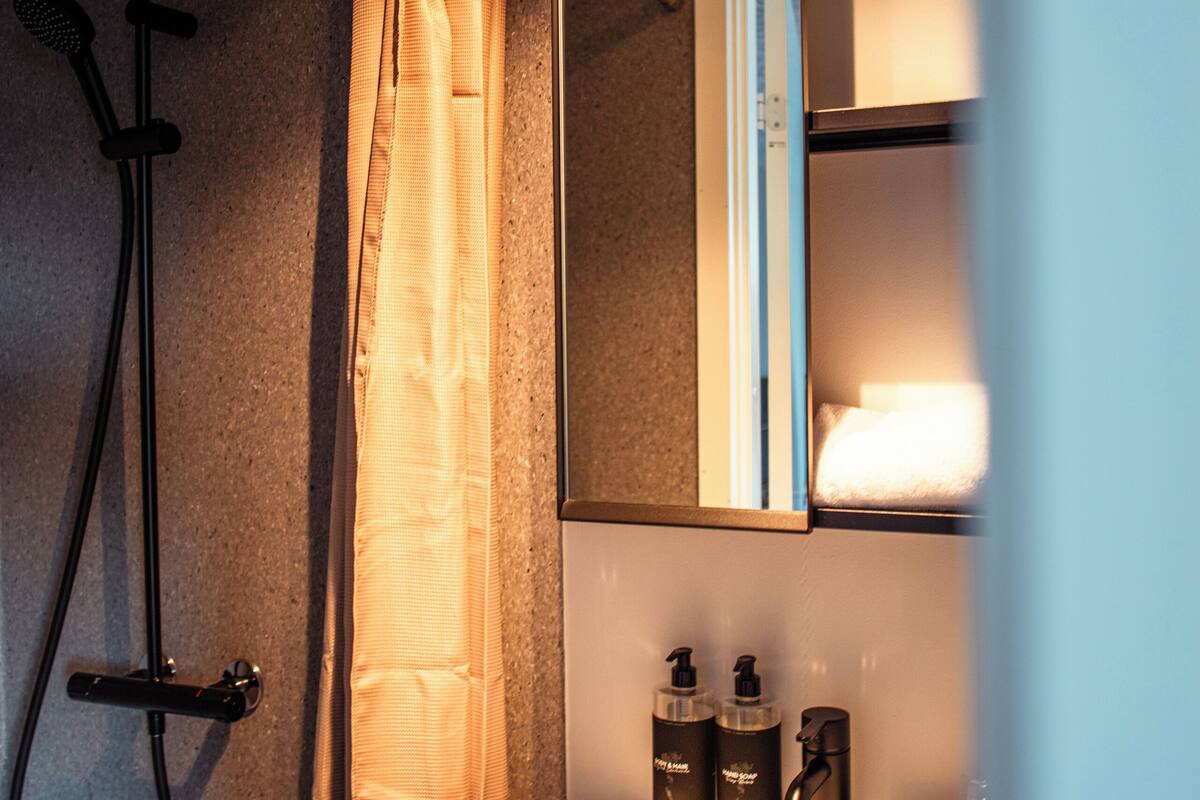 standard single room | bathroom | shower, hair dryer, towels, soap