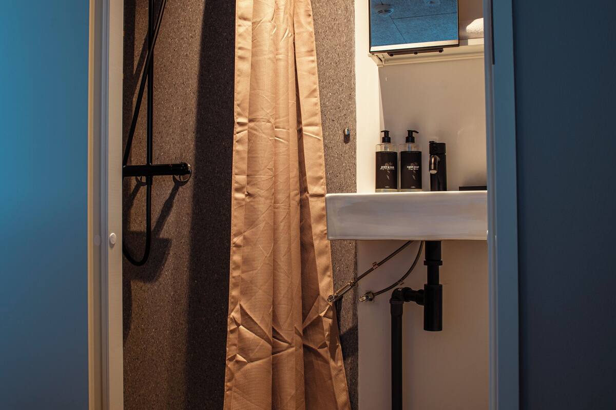 standard double room | bathroom | shower, hair dryer, towels, soap