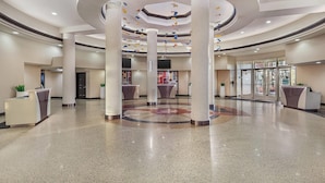A spacious lobby with a circular design, multiple reception desks, and a central column. - Bluegreen Vacations Club 36, an Ascend Collection Resort (Las Vegas)