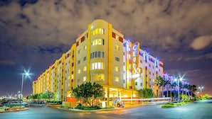 A multi-story hotel with a prominent '36' sign, featuring a modern design with balconies and a well-lit facade. - Bluegreen Vacations Club 36, an Ascend Collection Resort (Las Vegas)