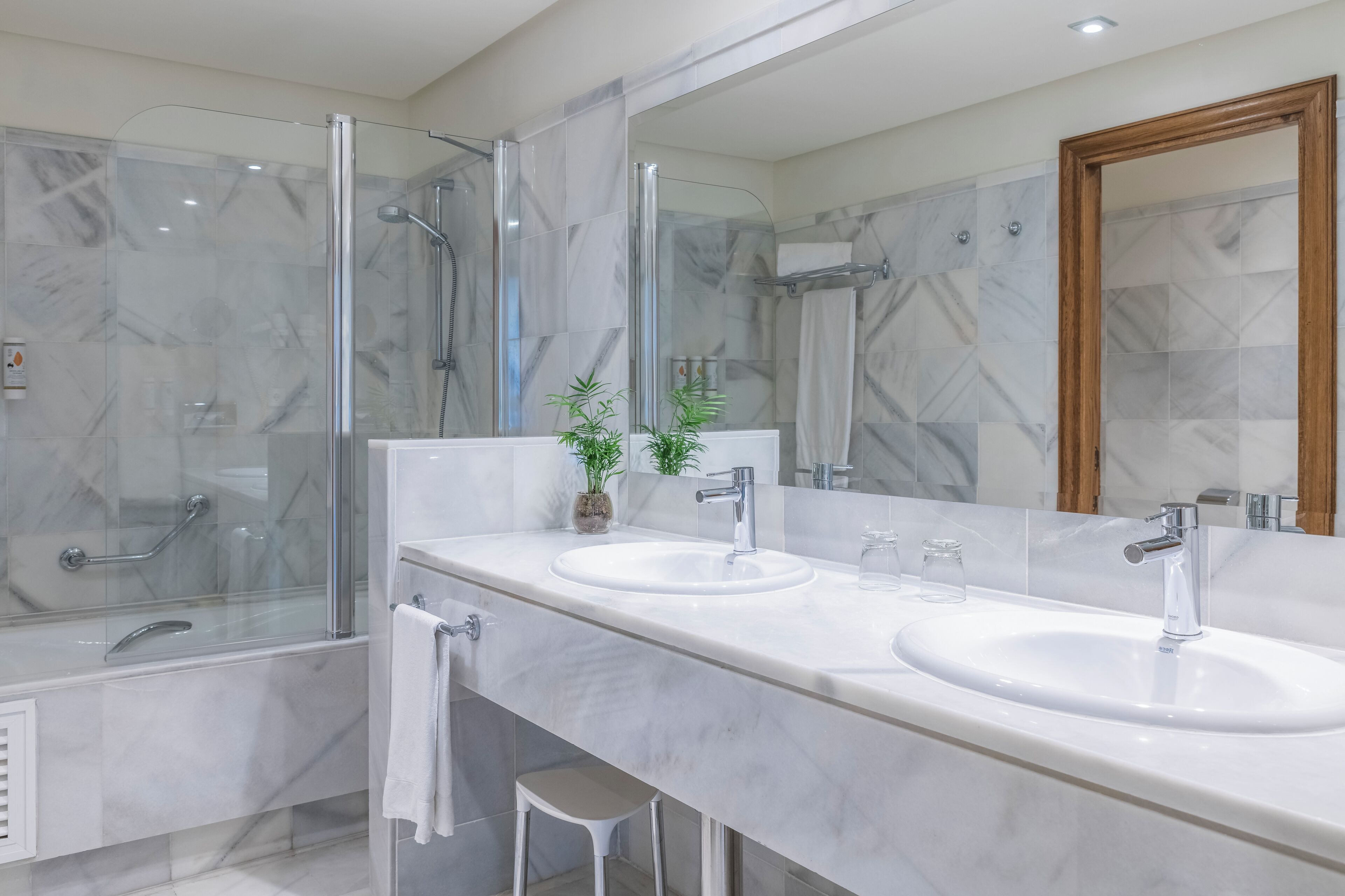 bathtub, eco-friendly toiletries, hair dryer, towels