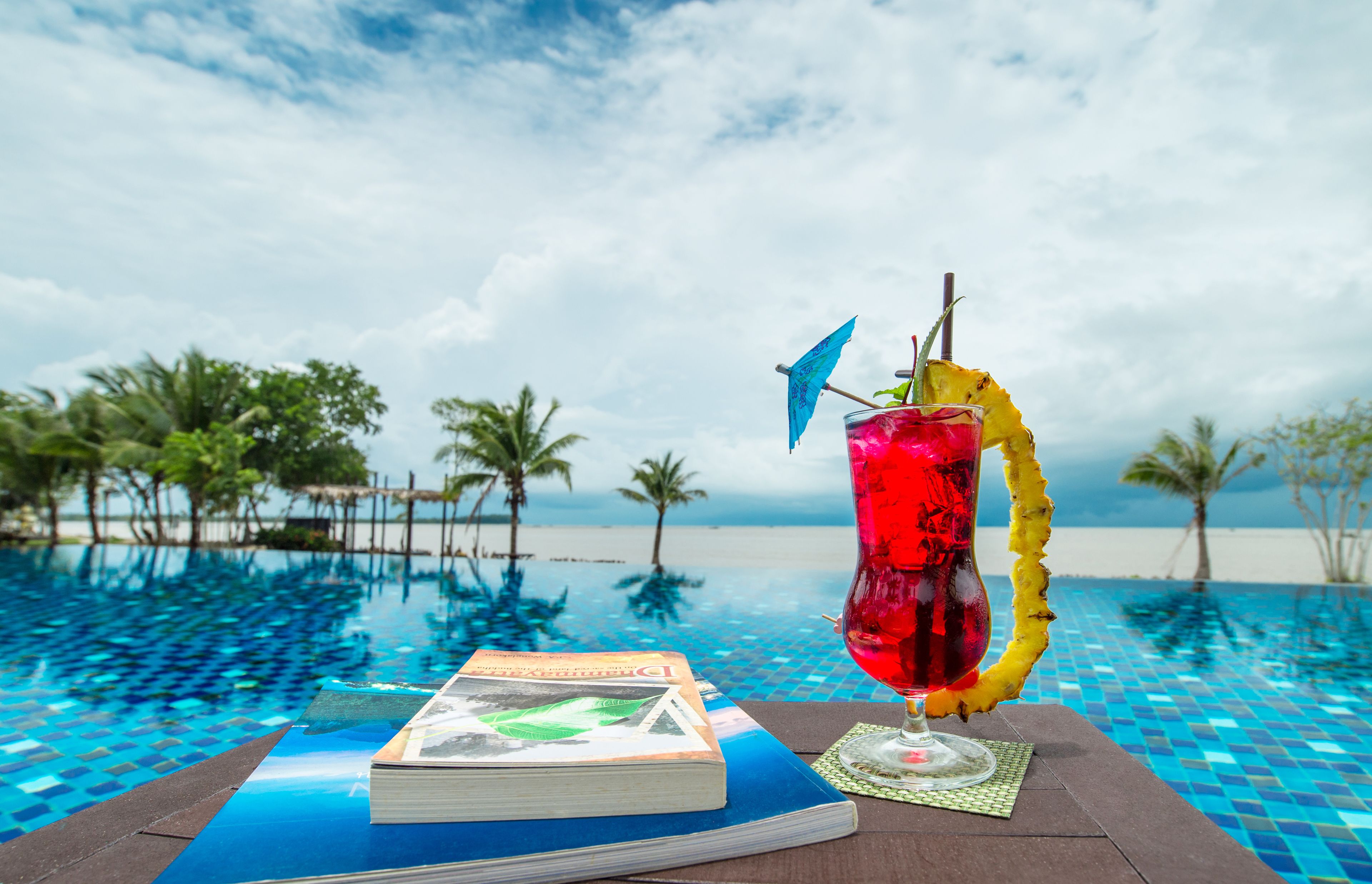 outdoor pool, open 7:00 am to 7:00 pm, pool umbrellas, pool loungers