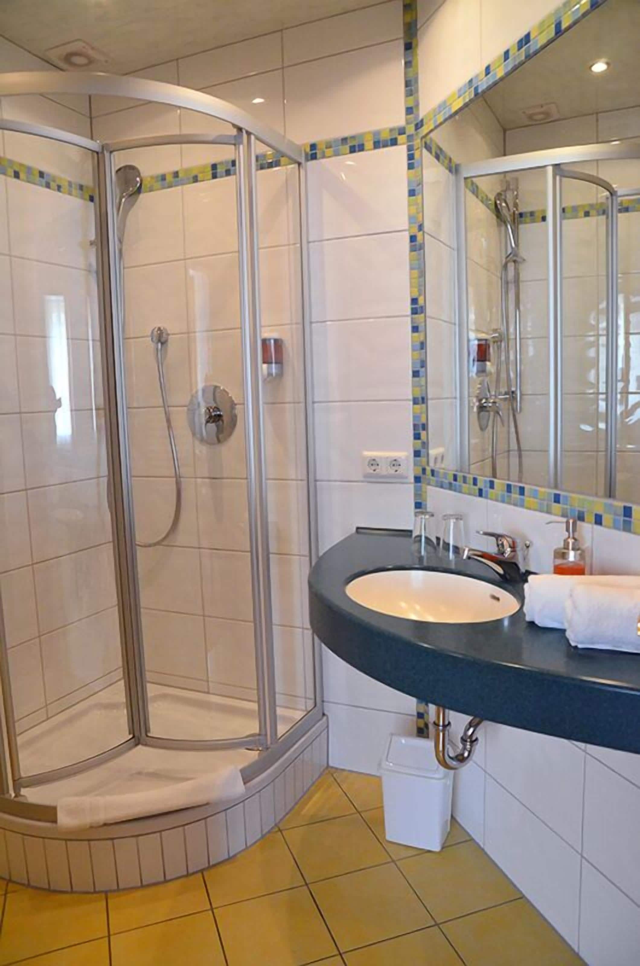 standard double room, 1 king bed | bathroom | hair dryer, towels