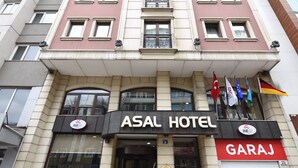 A multi-story building with a prominent sign for "ASAL HOTEL" and a "GARAJ" sign. - Asal Hotel (Ankara)