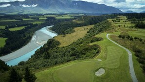 A golf course with a river, surrounded by forested hills and mountains. - Fable Terrace Downs Resort by Mgallery (Windwhistle)