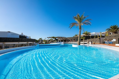 Outdoor pool, open 11:00 AM to 5:00 PM, pool umbrellas, pool loungers. Dream Bocayna Village Playa Blanca