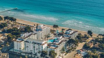 Guests can enjoy beach access and relax in our pools and outdoor seating areas.