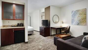 Premium bedding, desk, laptop workspace, iron/ironing board