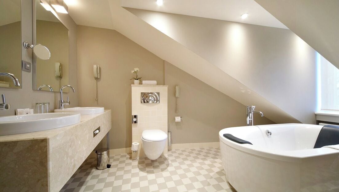 mansard family room | bathroom | free toiletries, hair dryer, heated floors, towels