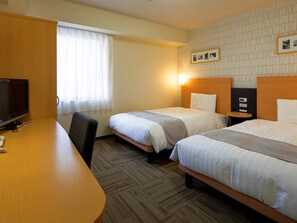 A hotel room with two beds, a desk, a television, and a window with curtains. - Comfort Hotel Nara (Nara)