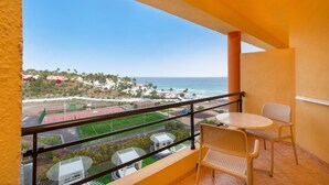 A balcony with a view of the ocean and a sports field. - Iberostar Waves Playa Gaviotas -All Inclusive (Pajara)