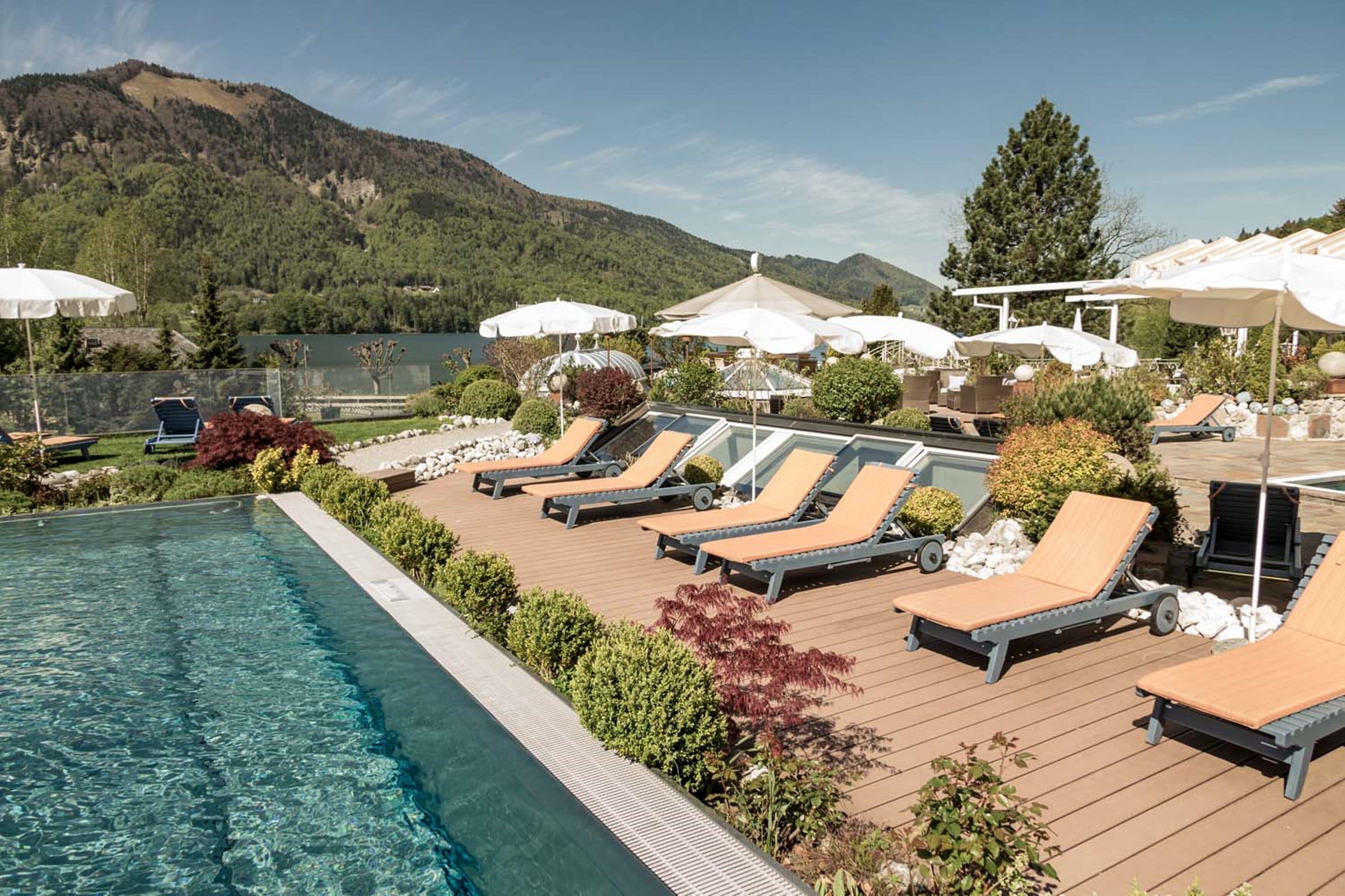 3 indoor pools, 2 outdoor pools, open 7 AM to 10:00 PM, pool umbrellas