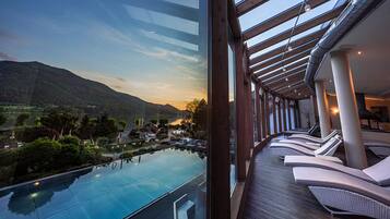 Enjoy breathtaking views of the serene landscape from the spacious balcony with a glass enclosure.