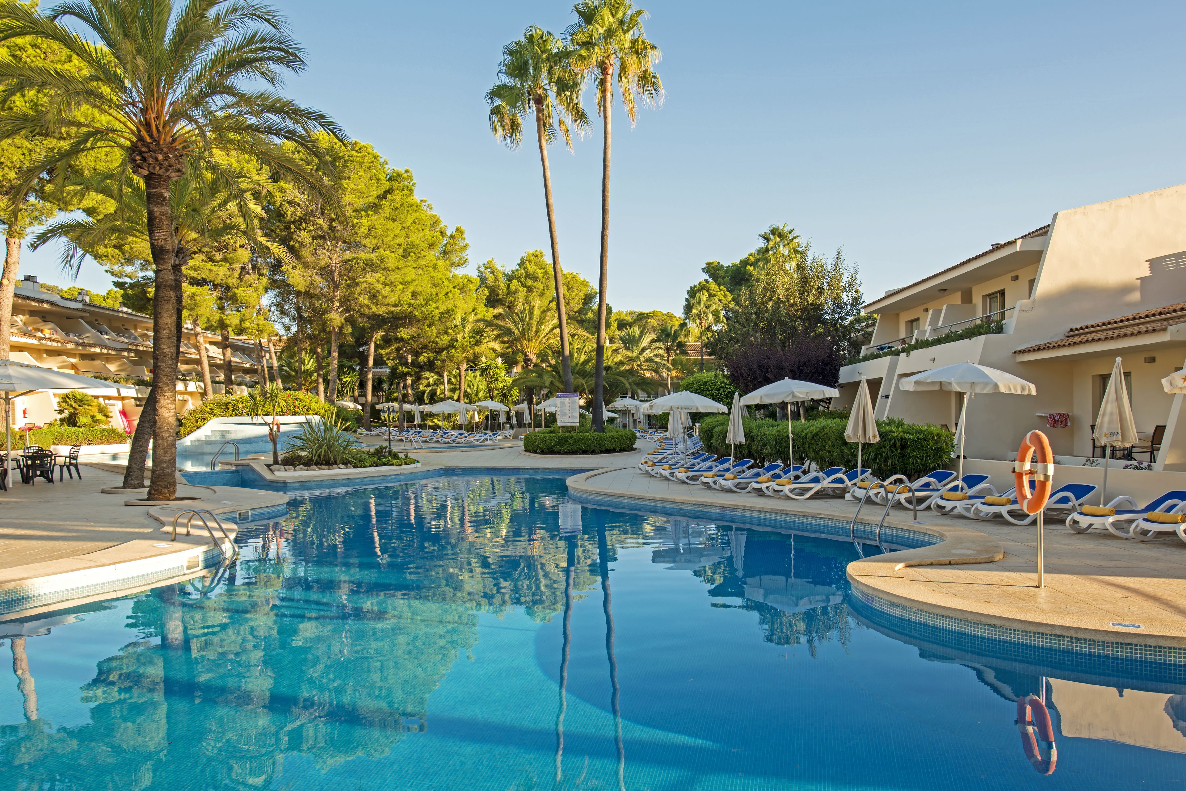 outdoor pool, pool umbrellas, pool loungers