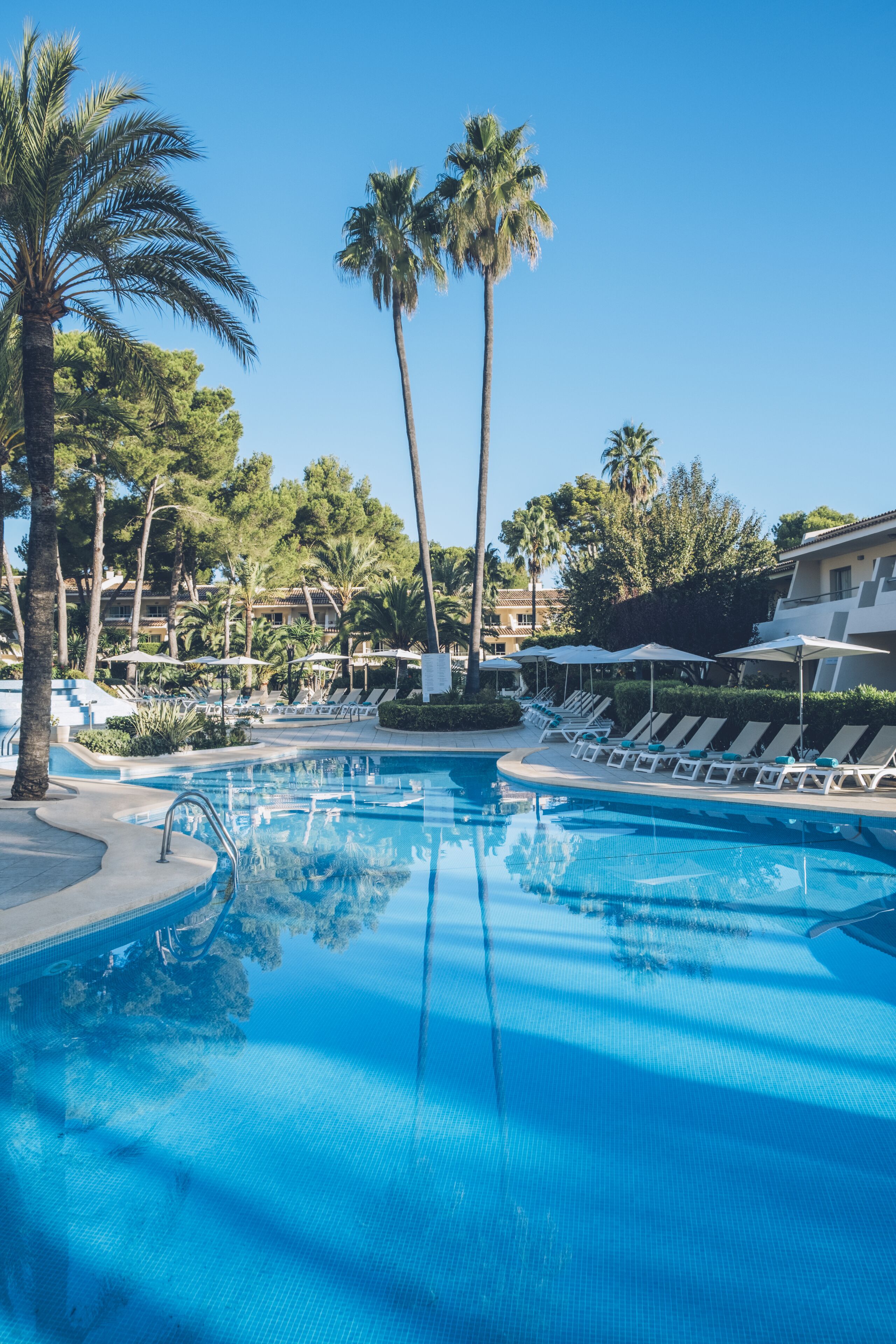 outdoor pool, pool umbrellas, pool loungers