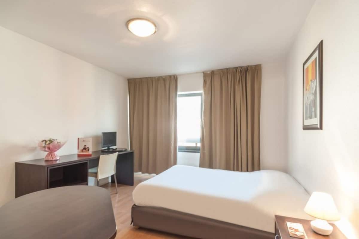 Desk, blackout drapes, WiFi (free), bed sheets