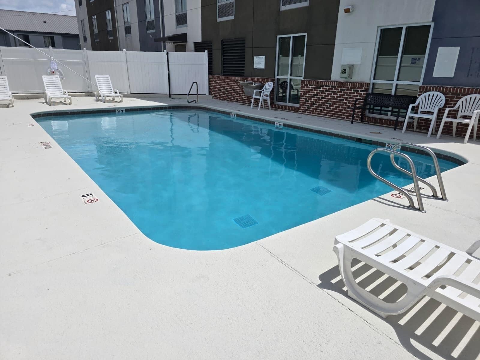 Seasonal outdoor pool, pool loungers