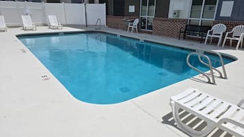 Seasonal outdoor pool, pool loungers