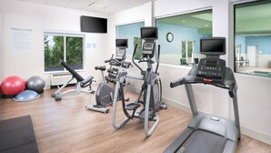 A fitness center with treadmills, elliptical machines, and exercise balls. - Holiday Inn Express Hotel & Suites Chattanooga Downtown by IHG (Chattanooga)