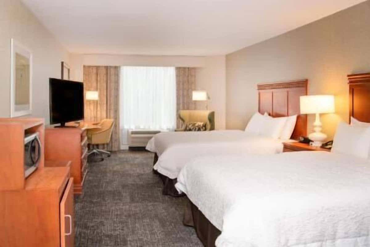 Premium bedding, down comforters, pillowtop beds, in-room safe