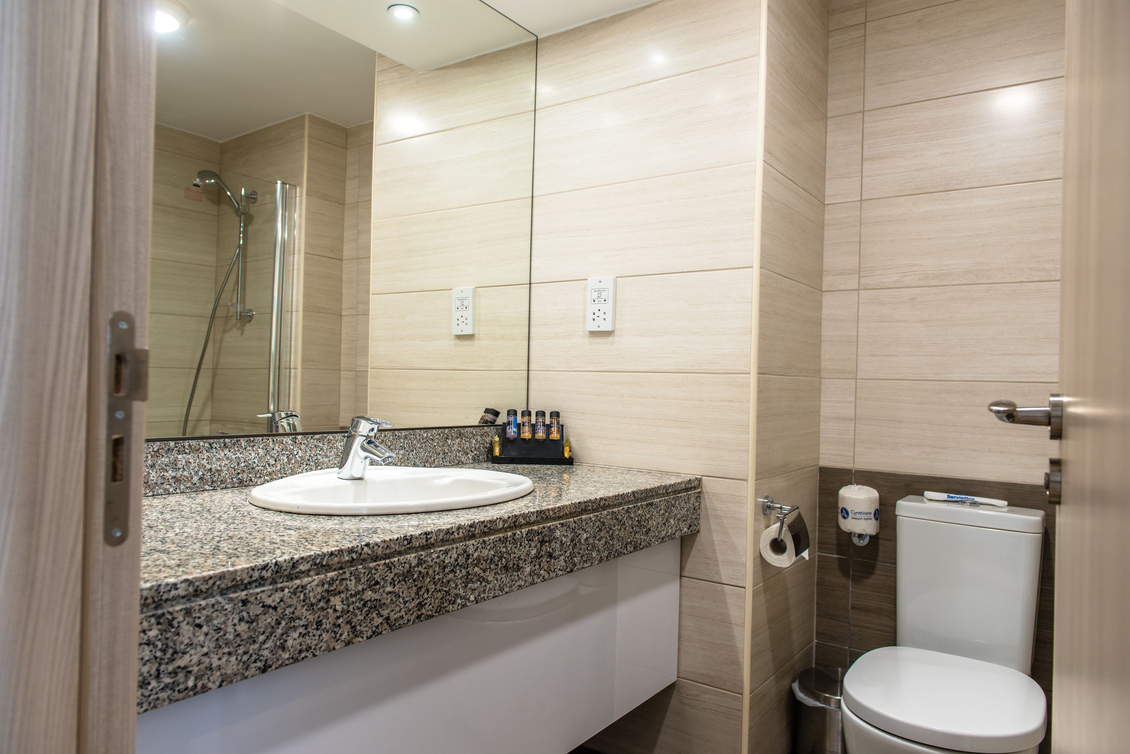 suite, 1 bedroom, sea view | bathroom | combined shower/bathtub, hair dryer, towels