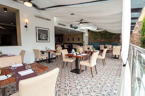 Lunch, dinner served; international cuisine, pool views