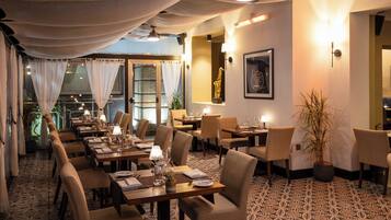 Lunch, dinner served; international cuisine, pool views