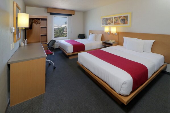 A hotel room with two beds, a desk, a chair, a wardrobe, and a window with a view. - City Express by Marriott Tepotzotlan (Tepotzotlán)
