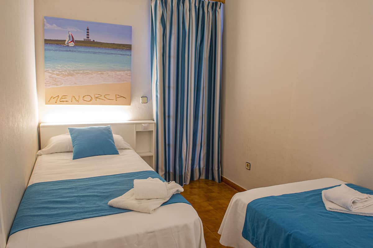 apartment, 2 bedrooms, terrace | down duvets, in-room safe, blackout curtains, iron/ironing board