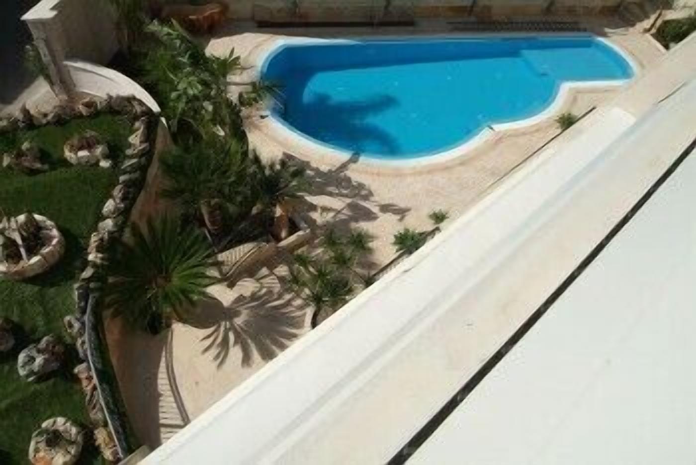 seasonal outdoor pool, pool umbrellas, pool loungers