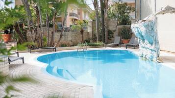 Seasonal outdoor pool, pool umbrellas, sun loungers