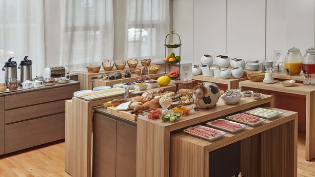 A breakfast buffet with various food items and beverages. - Hotel Edda Egilsstadir (Egilsstaðir)