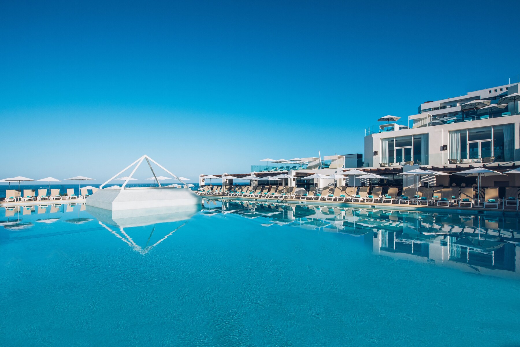 2 outdoor pools, pool umbrellas, pool loungers