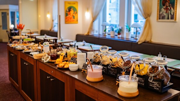 A buffet with various food items and drinks. - Hotel U Divadla (Prague)