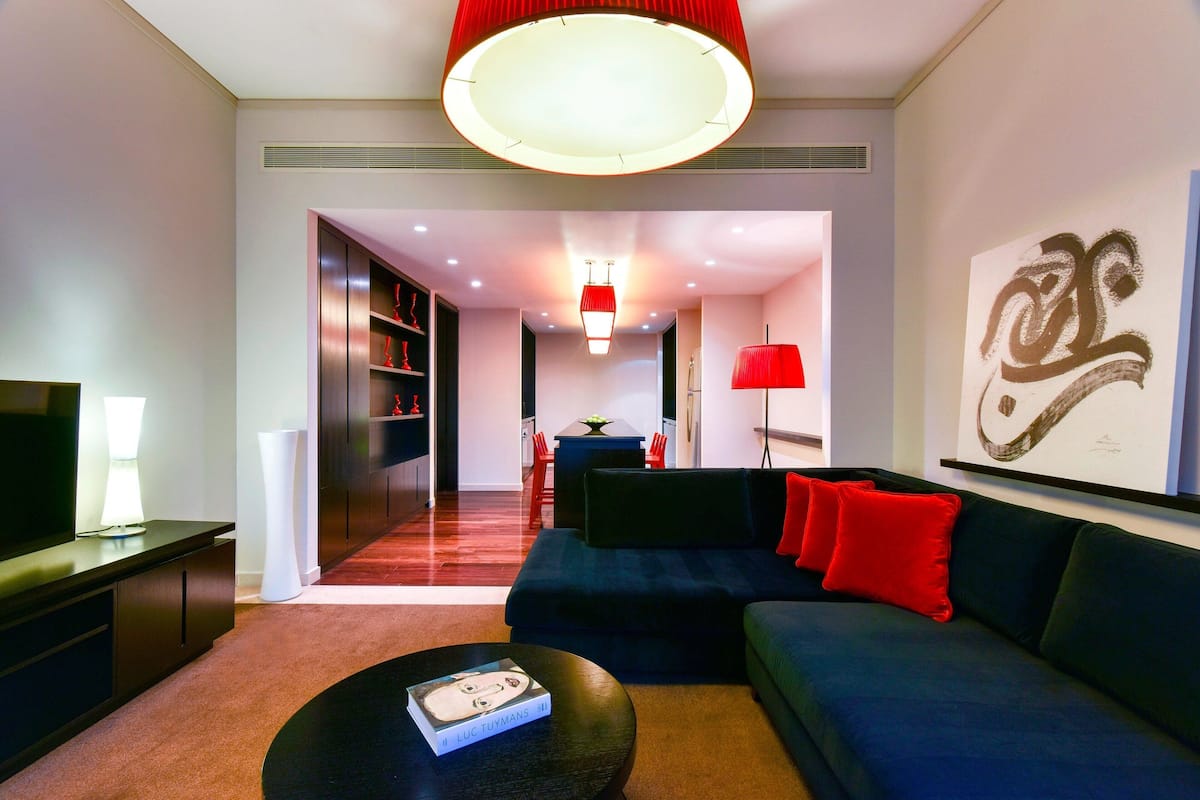 Suite, 2 Bedrooms, Non Smoking, City View | Living room | 32-inch LED TV with satellite channels, TV, iPod dock