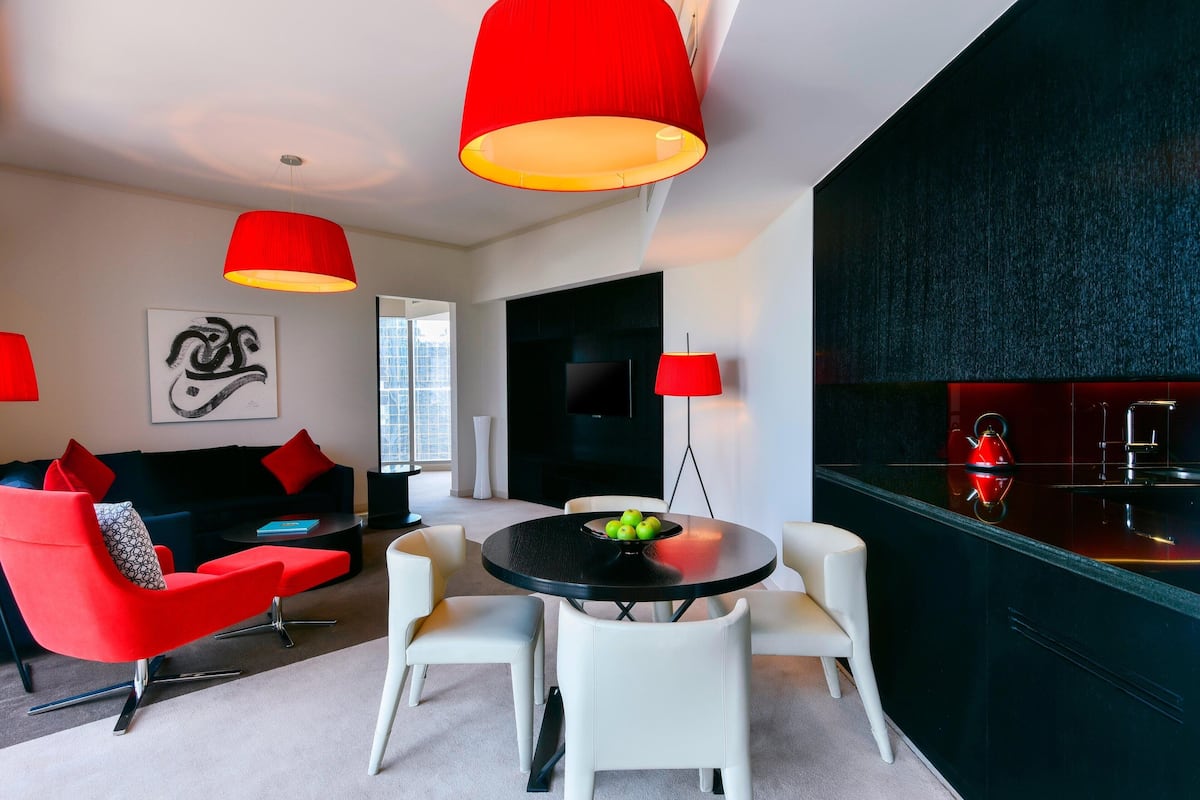 Suite, 1 Bedroom, Non Smoking | Living room | 32-inch LED TV with satellite channels, TV, iPod dock