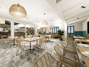 A spacious restaurant with high ceilings, wicker furniture, and large pendant lights.