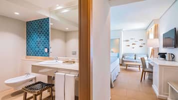 A modern bathroom with two sinks, a bidet, and a wooden stool.