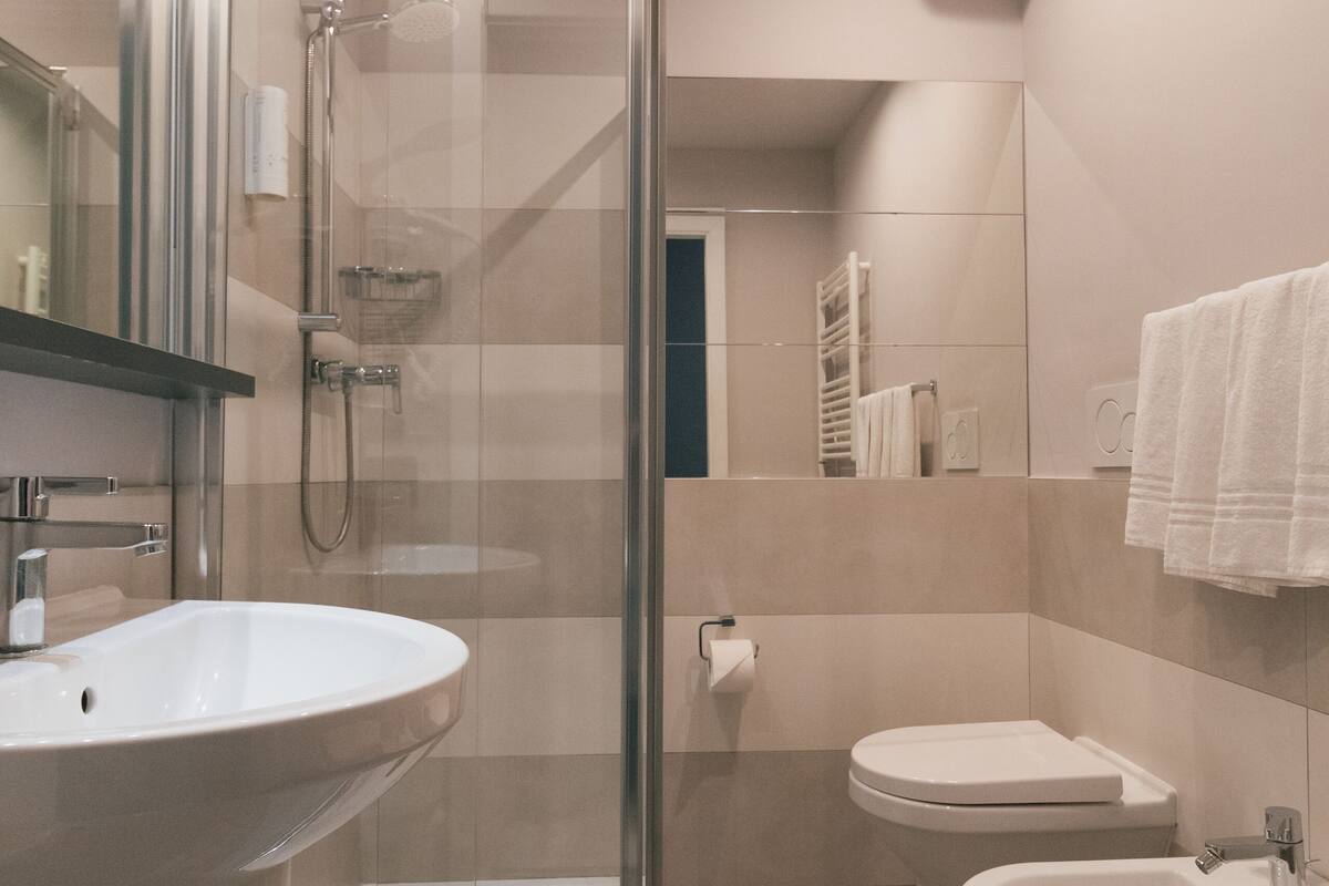 superior quadruple room | bathroom | shower, free toiletries, hair dryer, bidet