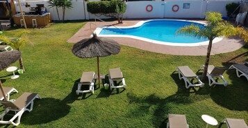 Seasonal outdoor pool, pool umbrellas, sun loungers