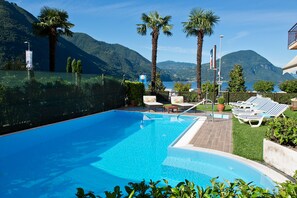 Seasonal outdoor pool, pool loungers
